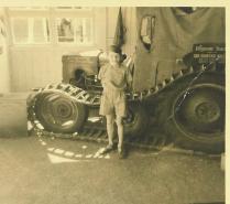 Peter at age seven beside his father's South Pole tractor.  